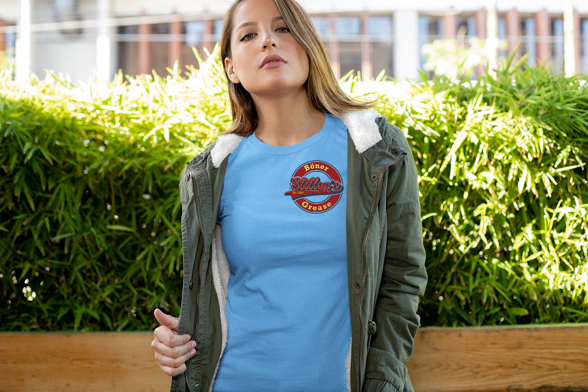 Young woman wearing Stitley's logo t-shirt in blue